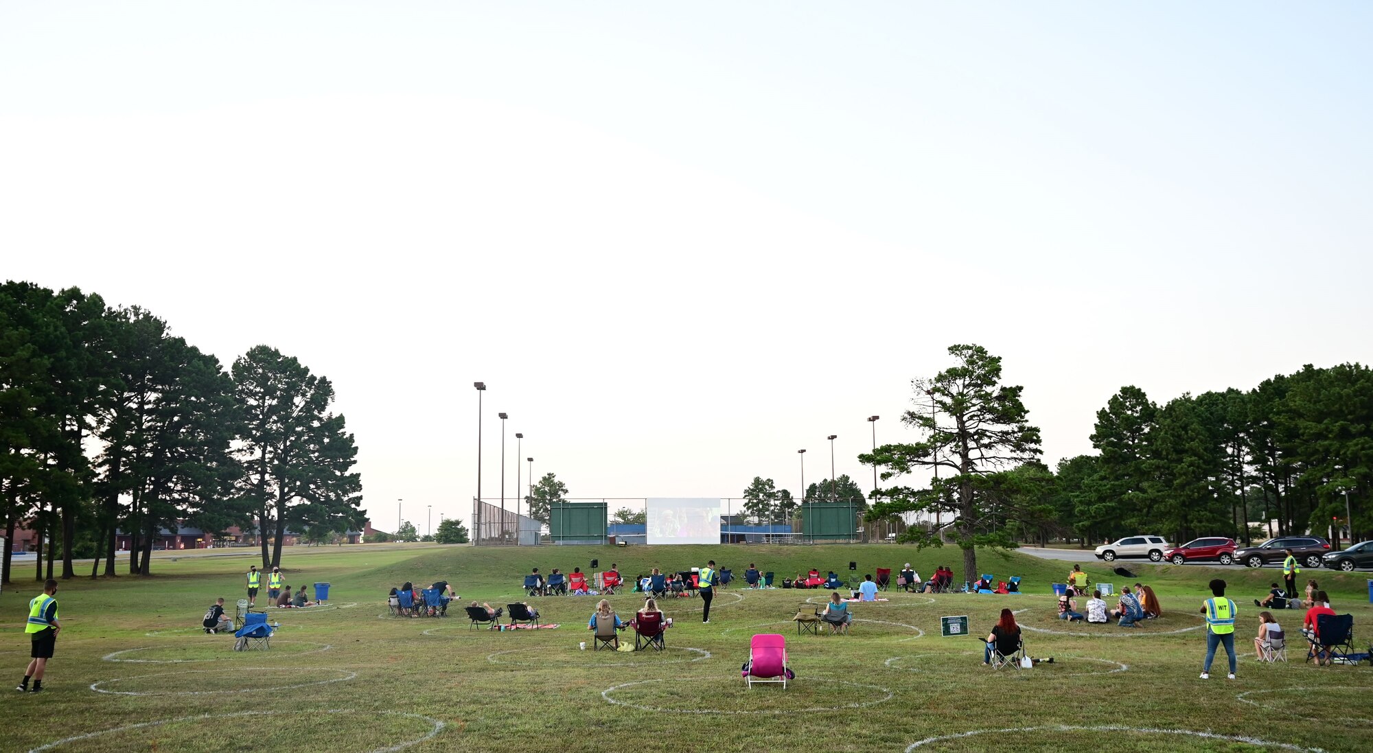 People watch a movie in the base park