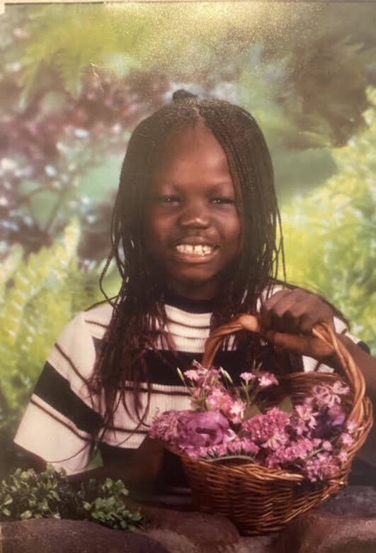 Airman 1st Class Nyarauch Chuol, passenger operations representative with the 32nd Aerial Port Squadron, poses for a school photo in Rosemount, Minnesota, on an unknown date.