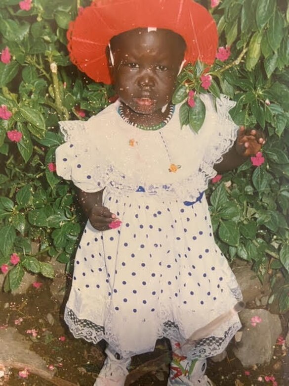 Airman 1st Class Nyarauch Chuol, passenger operations representative with the 32nd Aerial Port Squadron, poses for a photo in Addis Ababa, Ethiopia, 1994.