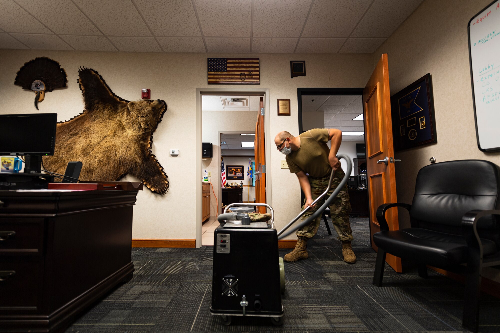 A photo of an Airman using a flood pumper