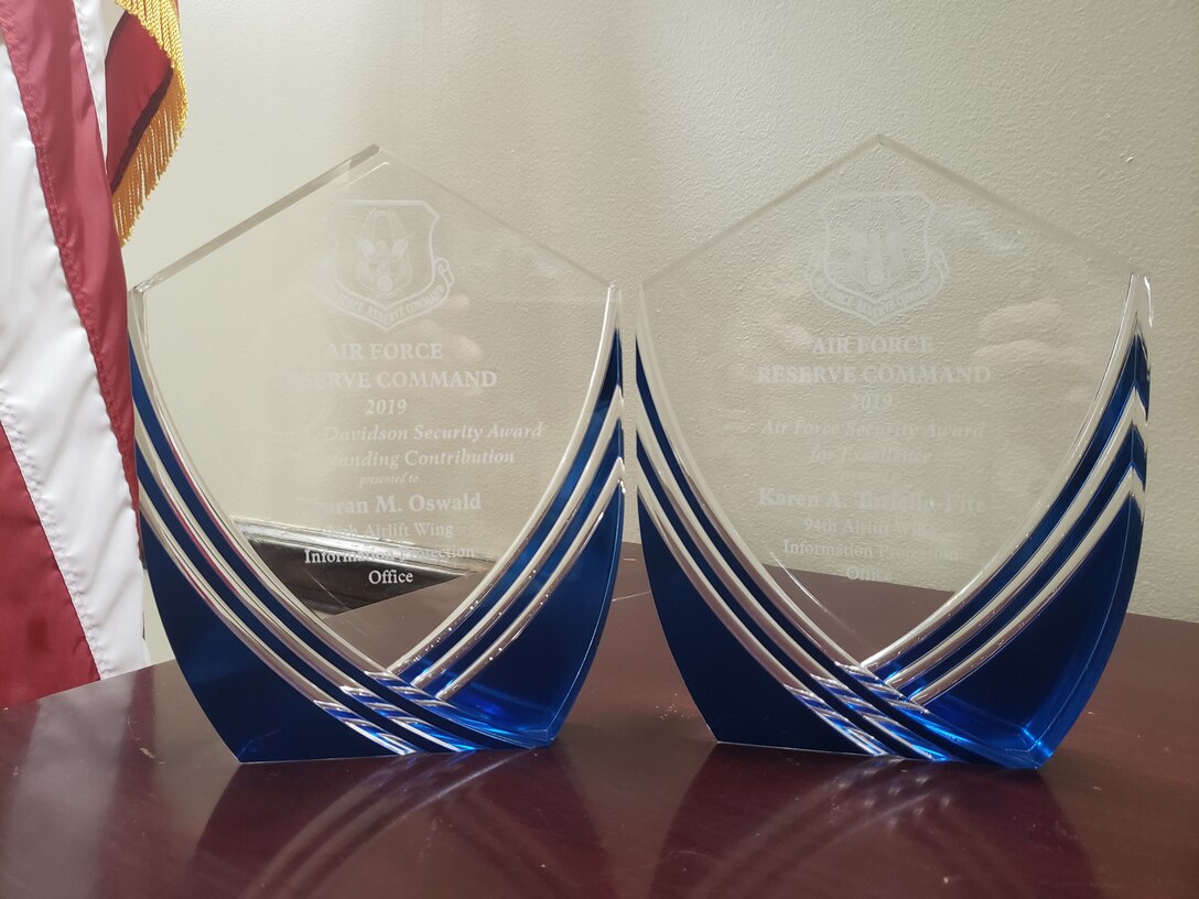 Karen Toriello-Fite, 94th Airlift Wing chief of information protection, and Lauran Oswald, 94th AW security specialist recently won two 2019 Security Community Awards at the Air Force Reserve Command level. The awards recognize the use of security concepts and knowledge from multiple security disciplines to support the command and Air Force missions. (Courtesy photo)