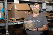 Boilermaker Darin Spradling shows off some of the masks available in the COVID-19 Fight Supplies Warehouse;