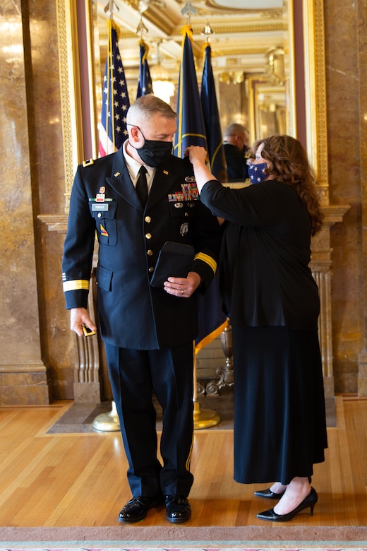 The Adjutant General, Maj. Gen. Michael J. Turley’s new rank is placed by with wife MaryLou at the Utah State Capitol, in the Gold Room, at his promotion ceremony Aug. 6, 2020.