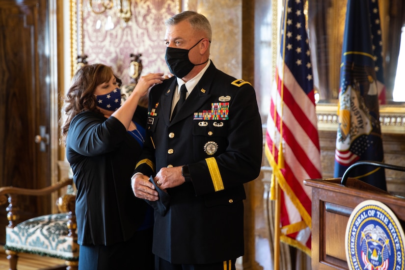 The Adjutant General, Maj. Gen. Michael J. Turley’s new rank is placed by with wife MaryLou at the Utah State Capitol, in the Gold Room, at his promotion ceremony Aug. 6, 2020.