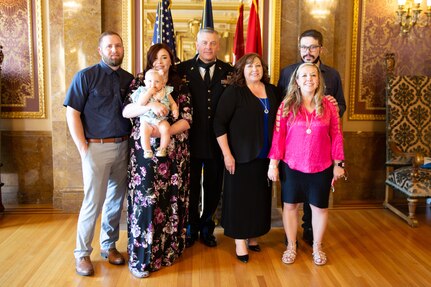 The Adjutant General, Maj. Gen. Michael J. Turley  with his family at the Utah State Capitol, in the Gold Room, after his promotion ceremony Aug. 6, 2020. Gov. Gary R. Herbert officiated at the ceremony and administered the oath of office. Turley's wife, MaryLou, pinned on his new rank with his family assembled in the Gold Room observing. Command Sgt. Maj. Spencer Nielsen unfurled and posted the two-star flag followed by offering the first salute. 
Due to COVID-19 social distancing those who attended in person were limited. The ceremony was broadcasted on Facebook Live where hundreds were able to be a part of this historical day.