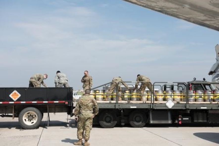 An Airman from the 5th Logistics Readiness Squadron hauls cargo at Minot Air Force Base, North Dakota, May 20, 2020. The 5th LRS modified pallets with rollers in order to efficiently change the way they work missions. (U.S. Air Force photo by Senior Airman Dillon Audit)