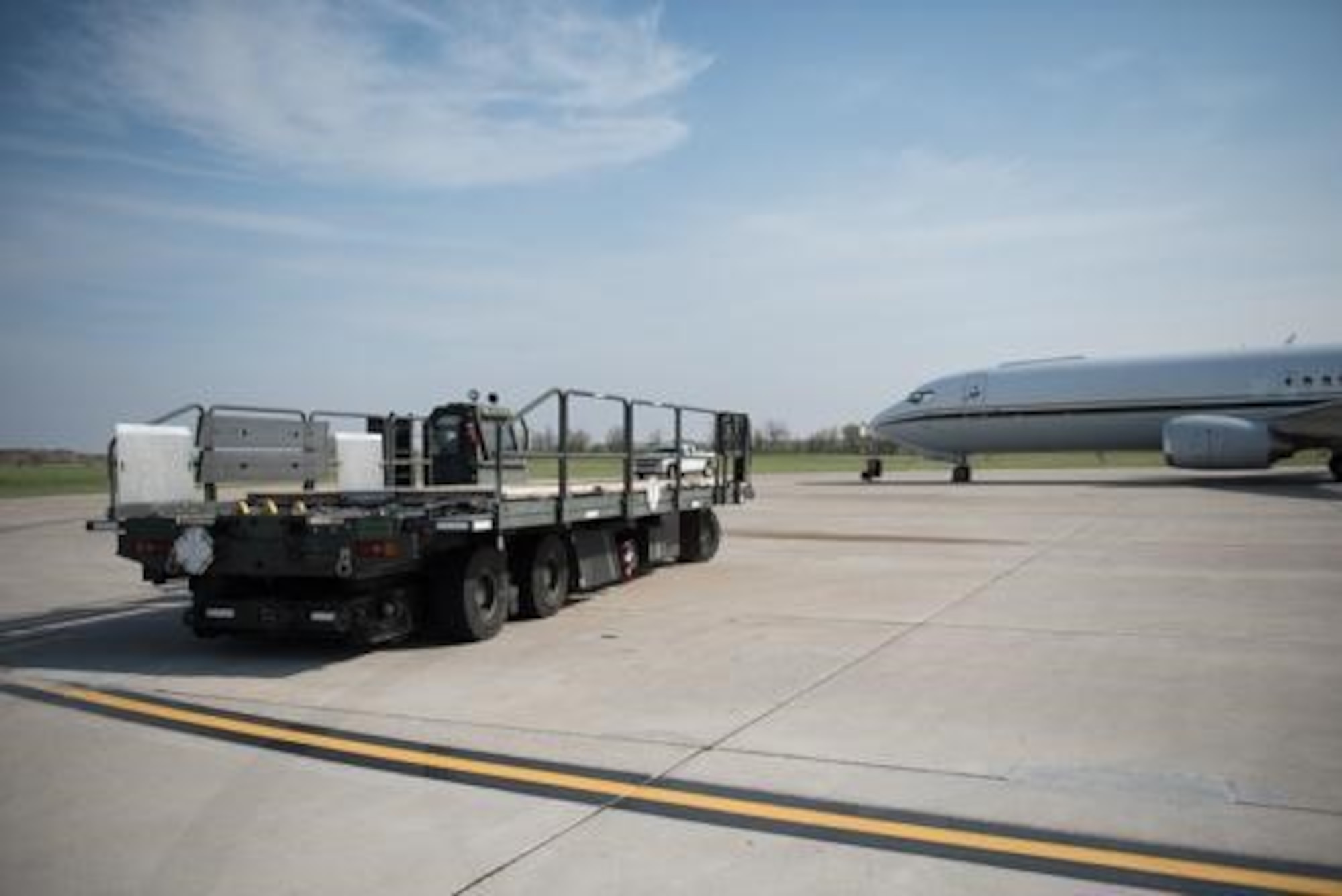 An Airman from the 5th Logistics Readiness Squadron hauls cargo at Minot Air Force Base, North Dakota, May 20, 2020. The 5th LRS modified pallets with rollers in order to efficiently change the way they work missions. (U.S. Air Force photo by Airmen 1st Class Jesse Jenny)