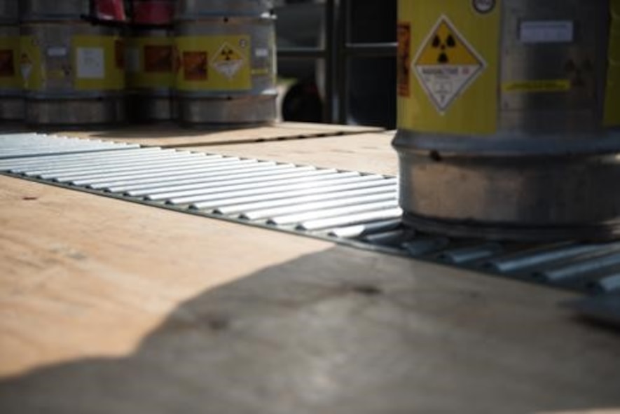 An Airman from the 5th Logistics Readiness Squadron hauls cargo at Minot Air Force Base, North Dakota, May 20, 2020. The 5th LRS modified pallets with rollers in order to efficiently change the way they work missions. (U.S. Air Force photo by Airmen 1st Class Jesse Jenny)