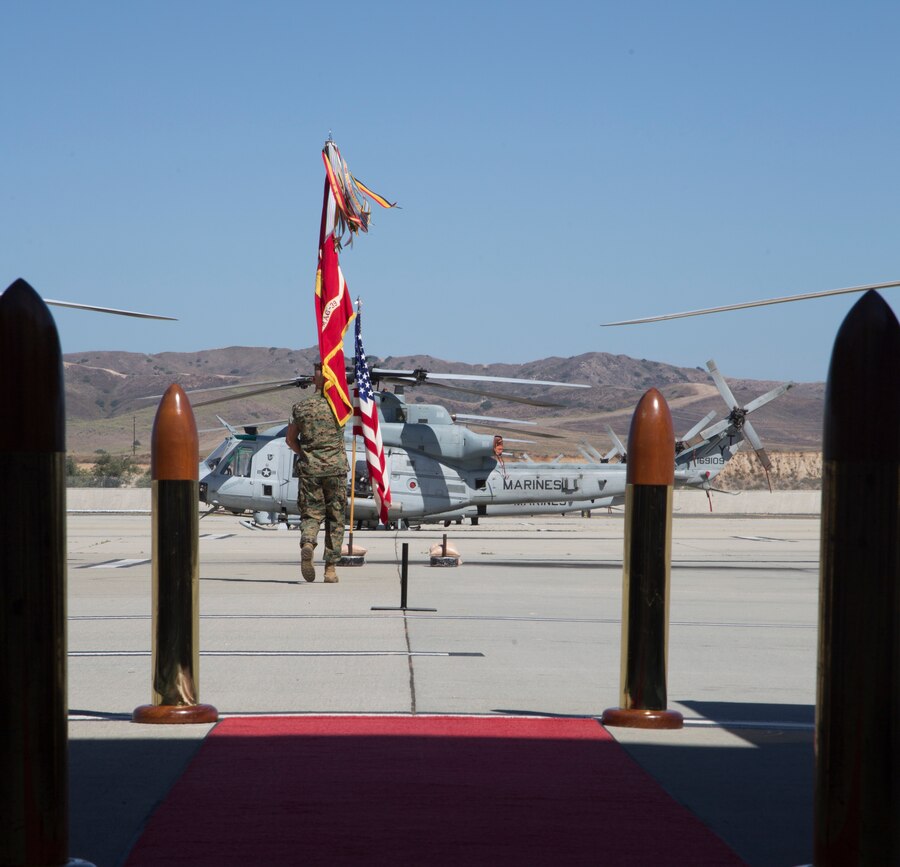 U.S. Marine Corps Sgt. Maj. Carey R. Wells with Marine Attack Helicopter Squadron (HMLA) 369, delivers the unit colors during a change of command ceremony at Marine Corps Air Station Camp Pendleton, Calif., Aug. 7, 2020. The ceremony was held to relinquish command from Lt. Col. Jeffrey M. Robb to Lt. Col. Gregory J. Youngberg. (U.S. Marine Corps photo by Lance Cpl. Jaime Reyes)