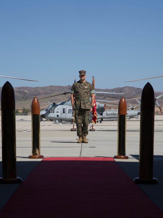 U.S. Marine Corps Lt. Col. Gregory J. Youngberg, incoming commanding officer of Marine Attack Helicopter Squadron (HMLA) 369, stands at attention during a change of command ceremony at Marine Corps Air Station Camp Pendleton, Calif., Aug. 7, 2020. The ceremony was held to relinquish command from Lt. Col. Jeffrey M. Robb to Youngberg. (U.S. Marine Corps photo by Lance Cpl. Jaime Reyes)