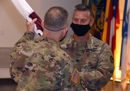 Col. John “Ryan” Bailey accepts the U.S. Army Medical Materiel Agency colors to assume command during a Change of Command ceremony Aug. 7 at Fort Detrick, Maryland. Presenting Bailey with the colors is Col. Michael Lalor, commander of Army Medical Logistics Command. USAMMA is a direct reporting unit to AMLC.