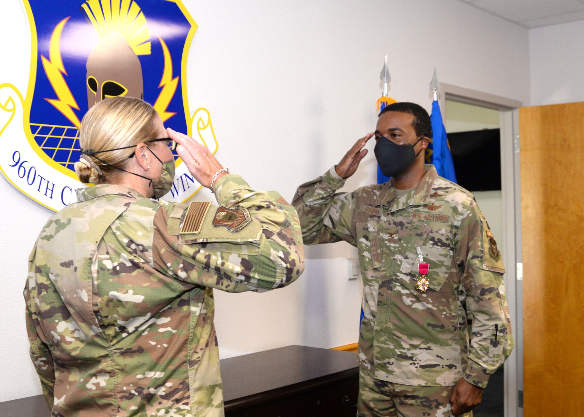 Col. Silas Darden, 960th Cyberspace Wing vice commander, is presented with the Legion of Merit by Col. Lori Jones, 960th CW commander, Aug. 8, 2020, at Joint Base San Antonio-Chapman Training Annex, Texas. (U.S. Air Force photo by Samantha Mathison)