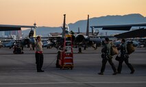 Maintainer salutes pilot.