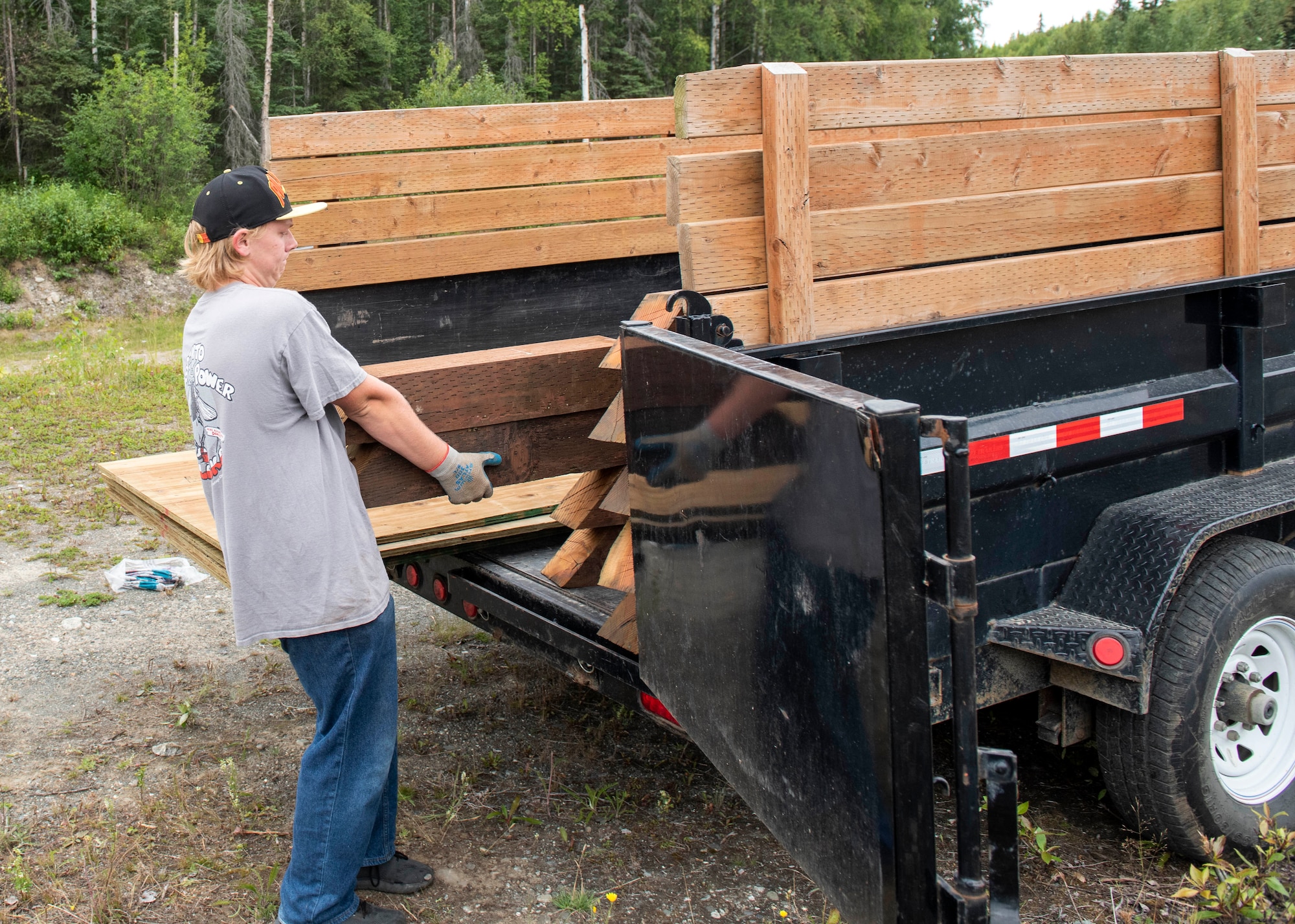 Daryn Moore, a member of Scouts BSA 54, lifts wood beams at Joint Base Elmendorf-Richardson, Alaska, Aug. 6, 2020. Moore built a pavilion with help from other Scouts and members of the 962nd Airborne Air Control Squadron to protect the memory box and cross at the Yukla 27 crash site from rain and snow. The pavilion is Moore’s Eagle Scout Service Project, a project that benefits the community as a requirement to gain the rank of Eagle Scout, the highest rank in Scouting.