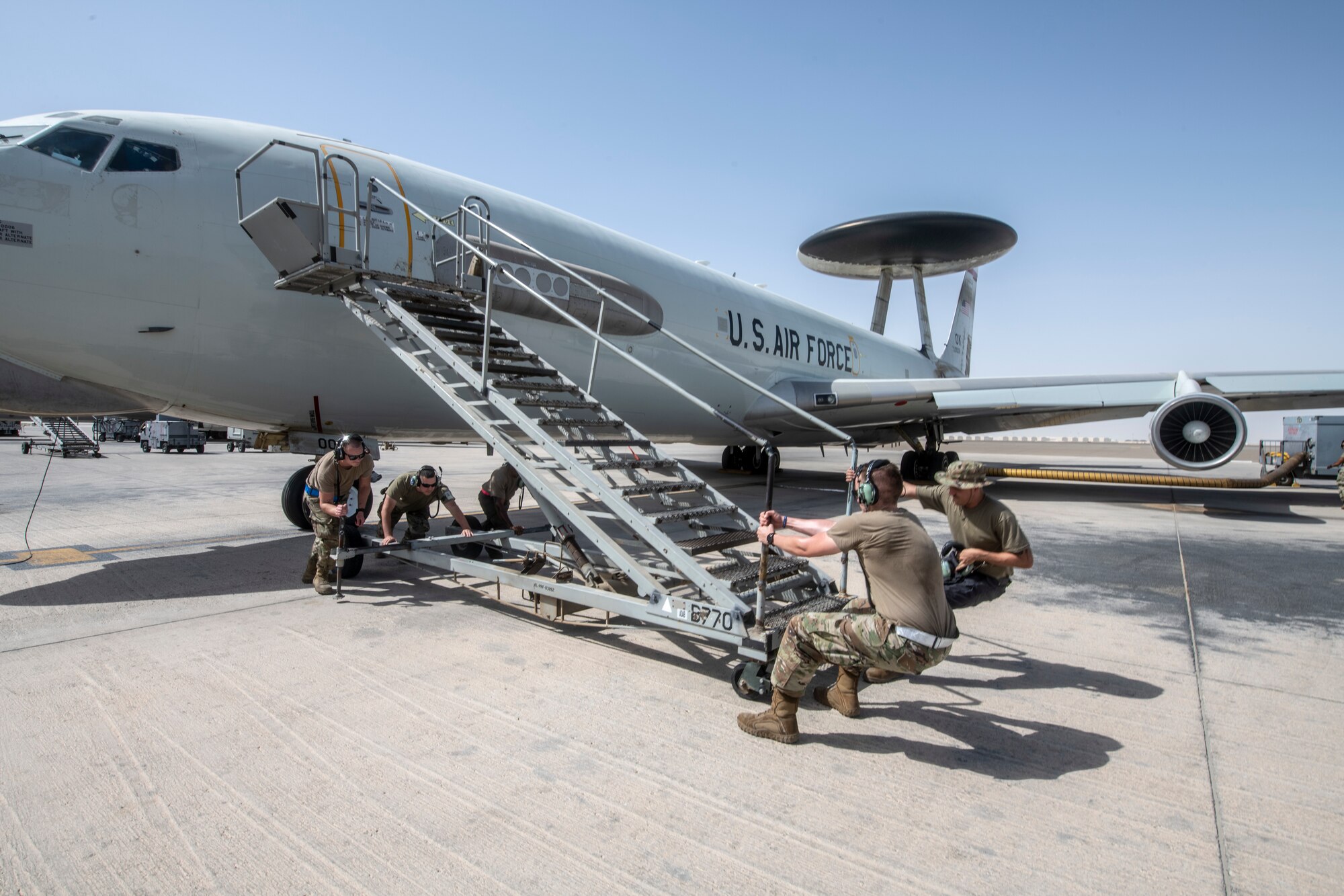 Airmen with the 380th Expeditionary Aircraft Maintenance Squadron E-3 Sentry Aircraft Maintenance Unit prepare an E-3 Sentry for flight July 28, 2020, here.