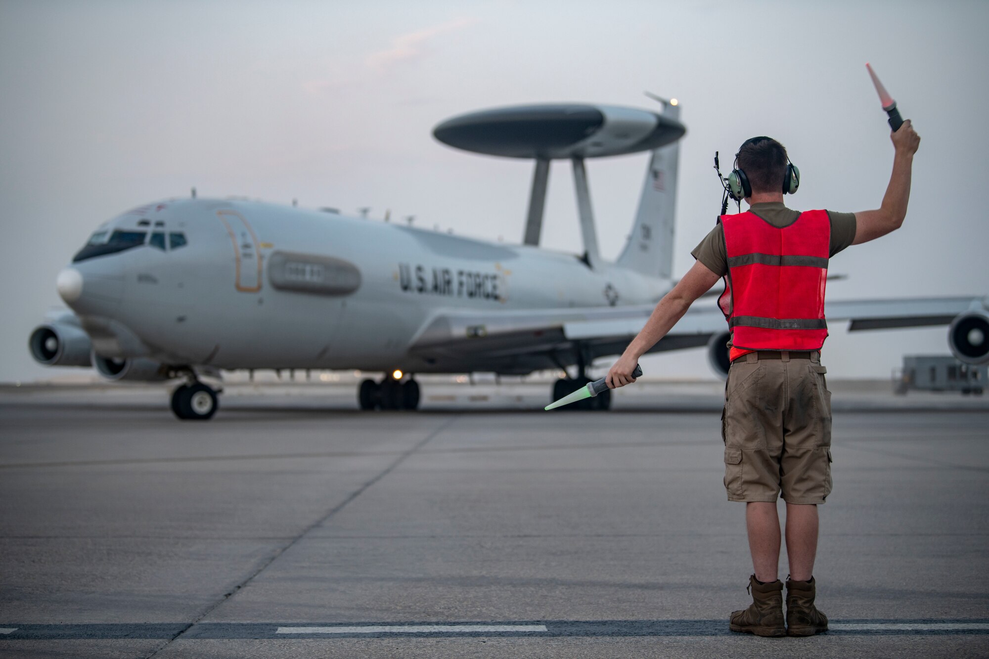 An Airman with the 380th Expeditionary Aircraft Maintenance Squadron E-3 Sentry Aircraft Maintenance Unit flags the 968th Expeditionary Airborne Air Control Squadron’s E-3 Sentry (AWACS) here July 18, 2020.