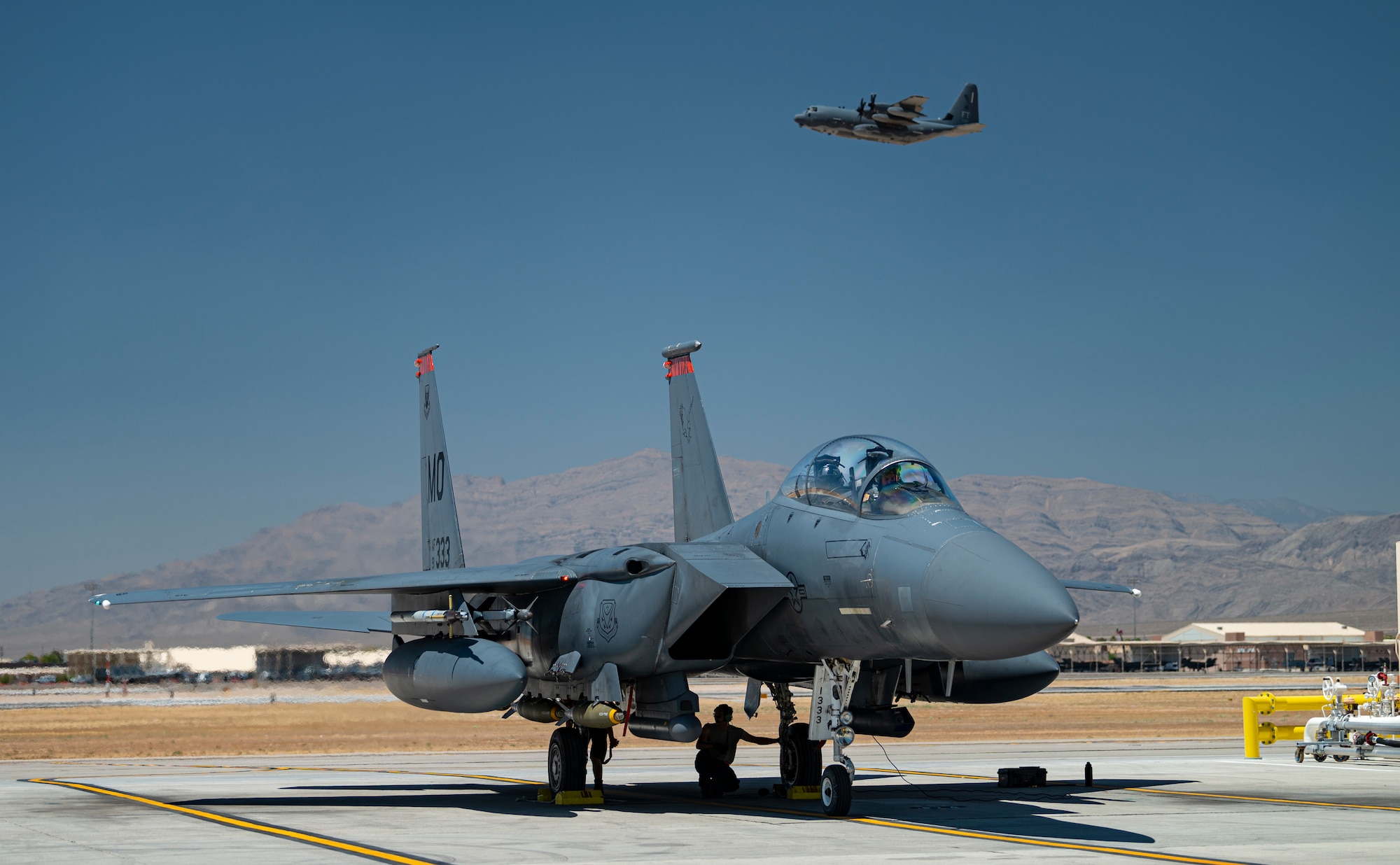 Aircraft sits on flight line.