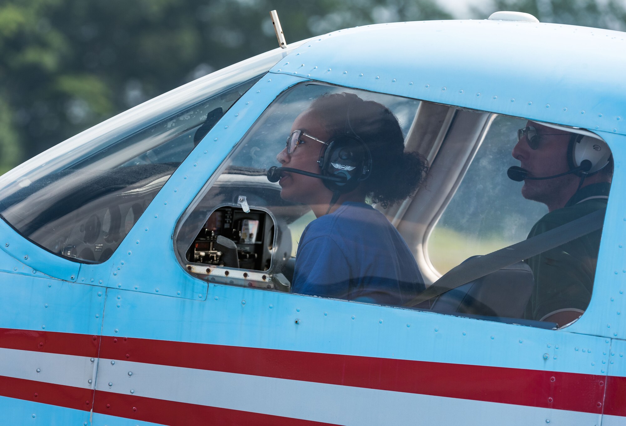 Air Force Junior ROTC cadet Maya Ross, prepares to taxi a Piper Warrior aircraft onto the runway Aug. 6, 2019, at Delaware Airpark in Cheswold, Del. Ross and her Delaware State University certified flight instructor flew around the airpark and practiced skills she learned during the eight-week AFJROTC Summer Flight Academy held at DSU. Ross is a cadet with AFJROTC Detachment BE-931, SHAPE American High School, Mons, Belgium. (U.S. Air Force photo by Roland Balik)