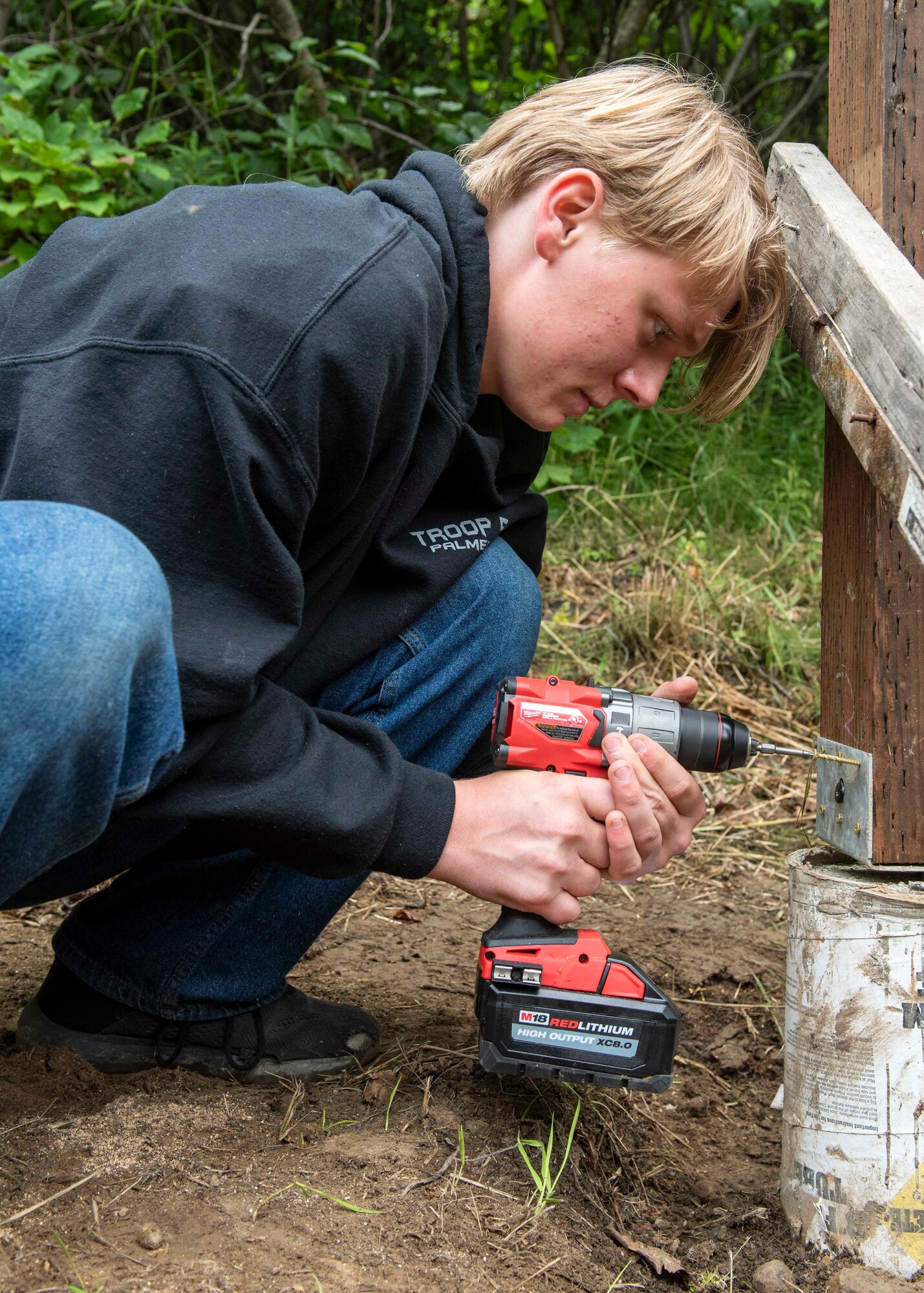 Daryn Moore, a member of Scouts BSA Troop 54, screws a bracket to a wood beam at Joint Base Elmendorf-Richardson, Alaska, Aug. 8, 2020. Moore built a pavilion with help from other Scouts and members of the 962nd Airborne Air Control Squadron to protect the memory box and cross at the Yukla 27 crash site from rain and snow. The pavilion is Moore’s Eagle Scout Service Project, a project that benefits the community as a requirement to gain the rank of Eagle Scout, the highest rank in Scouting.