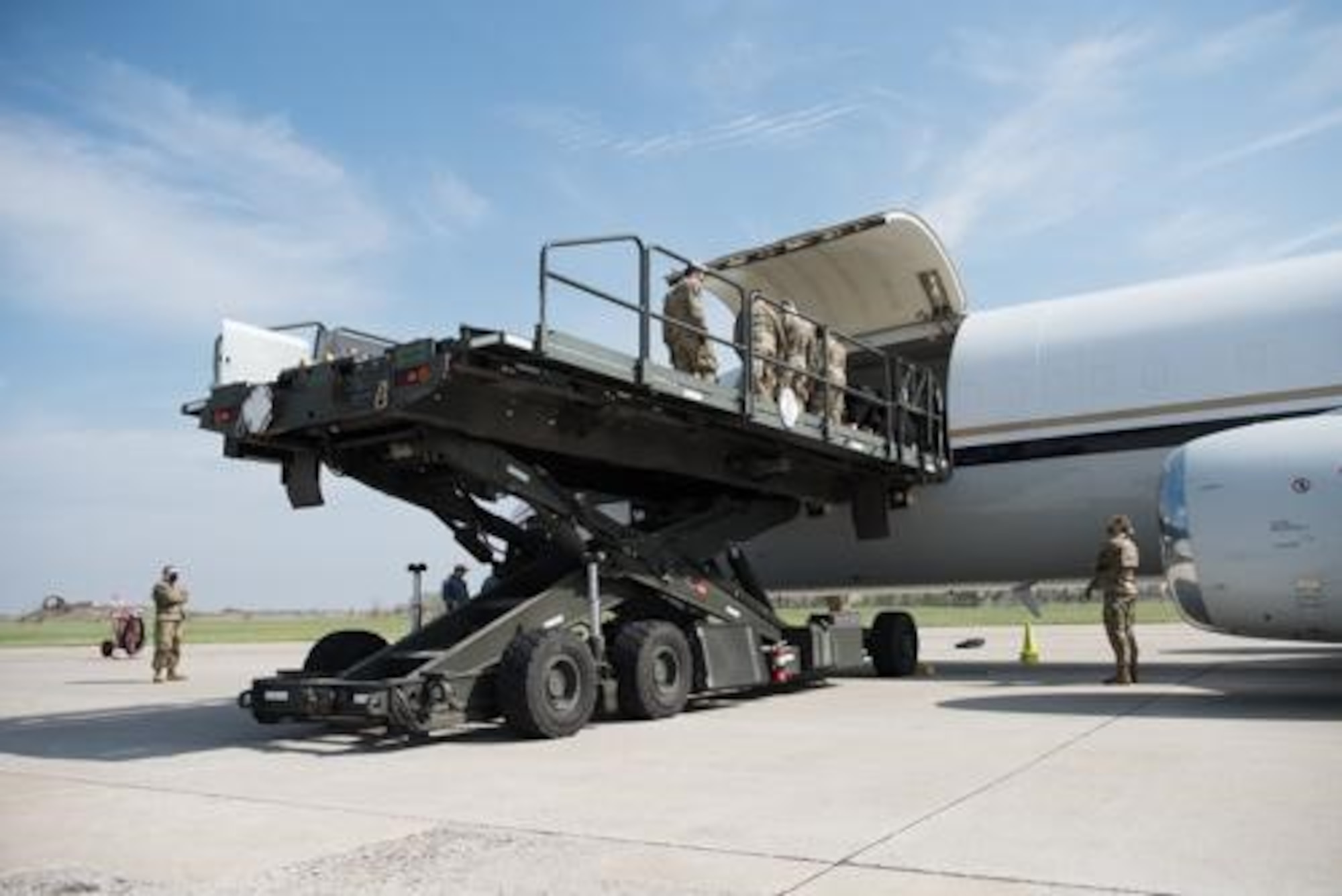 An Airman from the 5th Logistics Readiness Squadron hauls cargo at Minot Air Force Base, North Dakota, May 20, 2020. The 5th LRS modified pallets with rollers in order to efficiently change the way they work missions. (U.S. Air Force photo by Airmen 1st Class Jesse Jenny)