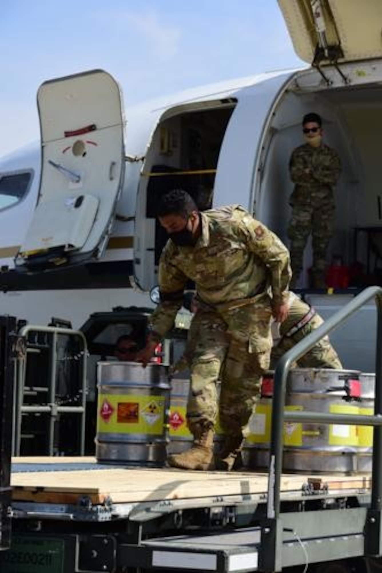 An Airman from the 5th Logistics Readiness Squadron hauls cargo at Minot Air Force Base, North Dakota, May 20, 2020. The 5th LRS modified pallets with rollers in order to efficiently change the way they work missions. (U.S. Air Force photo by Airmen 1st Class Jesse Jenny)