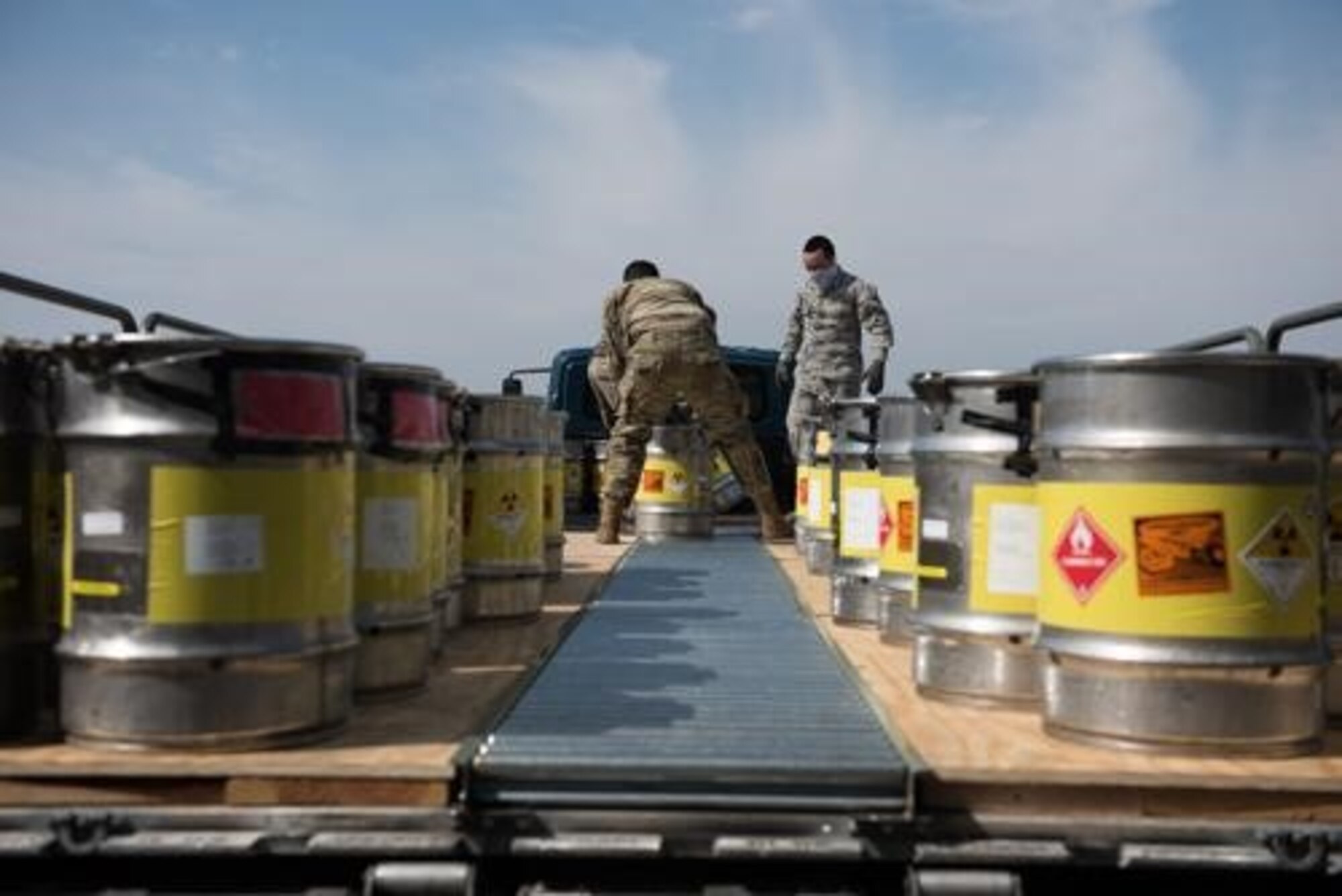 An Airman from the 5th Logistics Readiness Squadron hauls cargo at Minot Air Force Base, North Dakota, May 20, 2020. The 5th LRS modified pallets with rollers in order to efficiently change the way they work missions. (U.S. Air Force photo by Airmen 1st Class Jesse Jenny)