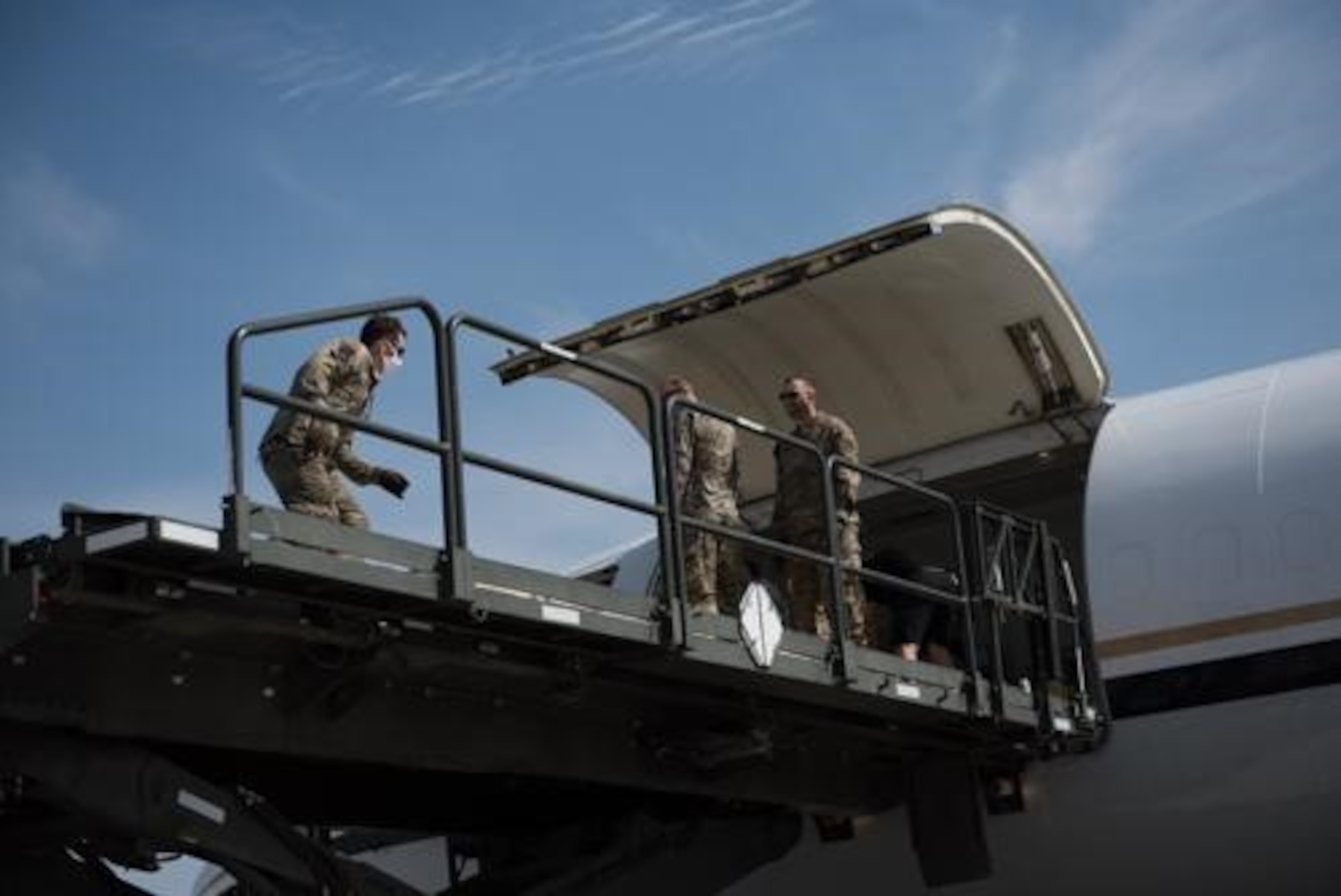 An Airman from the 5th Logistics Readiness Squadron hauls cargo at Minot Air Force Base, North Dakota, May 20, 2020. The 5th LRS modified pallets with rollers in order to efficiently change the way they work missions. (U.S. Air Force photo by Airmen 1st Class Jesse Jenny)