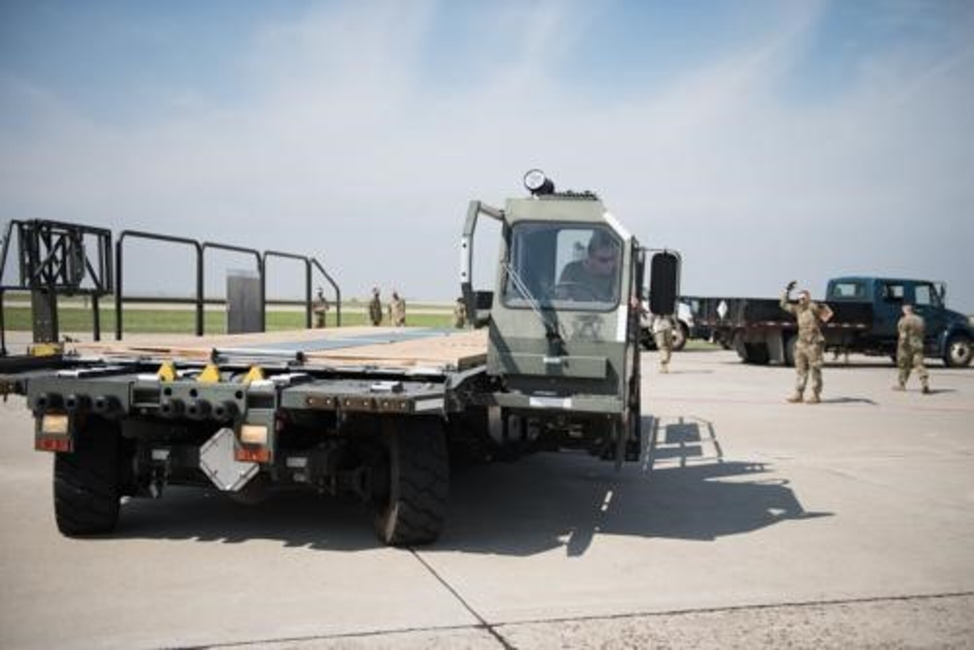 An Airman from the 5th Logistics Readiness Squadron hauls cargo at Minot Air Force Base, North Dakota, May 20, 2020. The 5th LRS modified pallets with rollers in order to efficiently change the way they work missions. (U.S. Air Force photo by Senior Airman Dillon Audit)