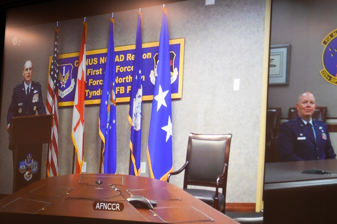 general officer talks at a podium