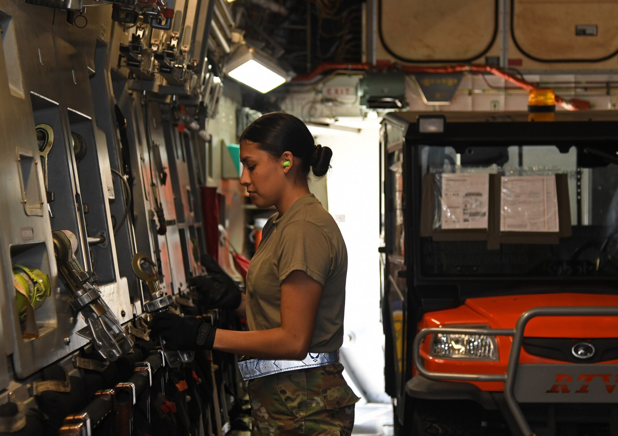 An Airman inspects a plane.