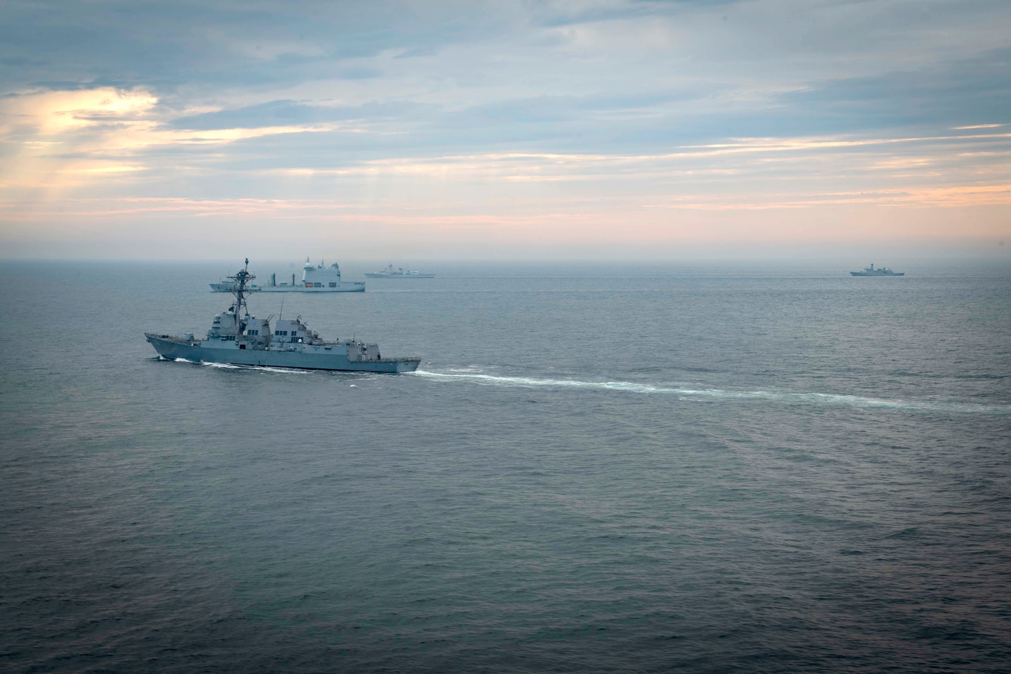 The Arleigh Burke-class guided-missile destroyer USS Thomas Hudner (DDG 116) transits in formation with ships participating in Operation Nanook from the U.S. Coast Guard, Royal Canadian Navy, Royal Danish Navy and French Navy., Aug. 9, 2020.