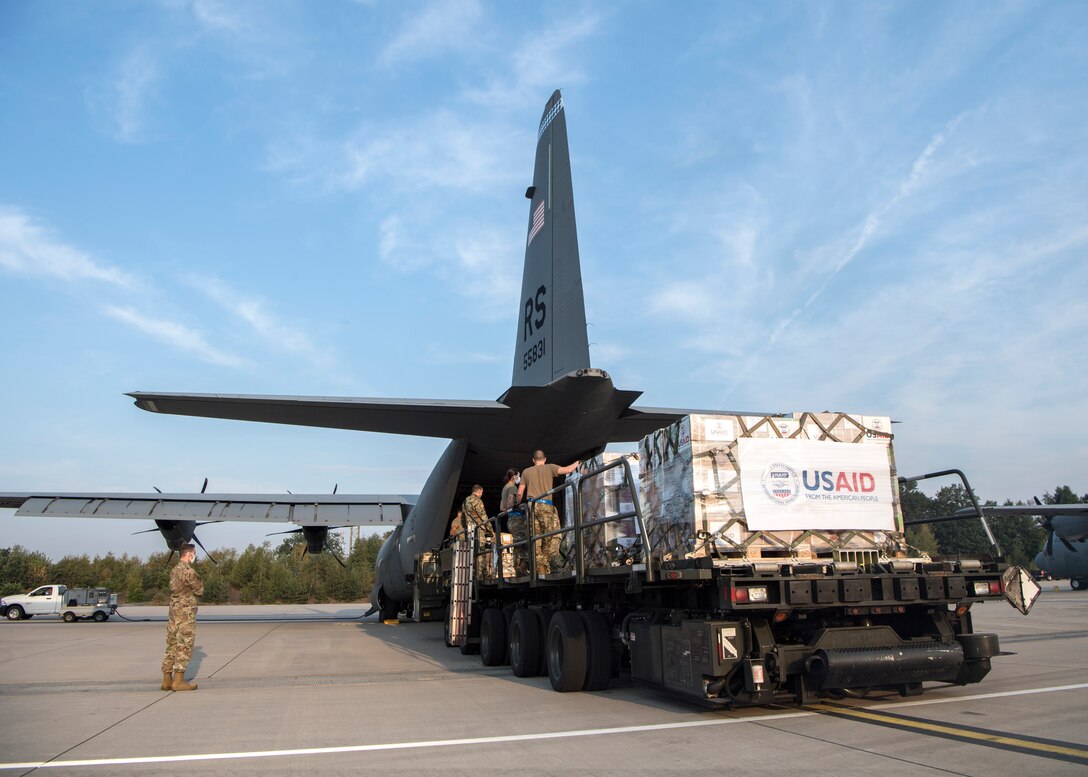 Members of the 721st Aerial Port Squadron load a C-130J Super Hercules at Ramstein Air Base, Germany, Aug. 11, 2020.