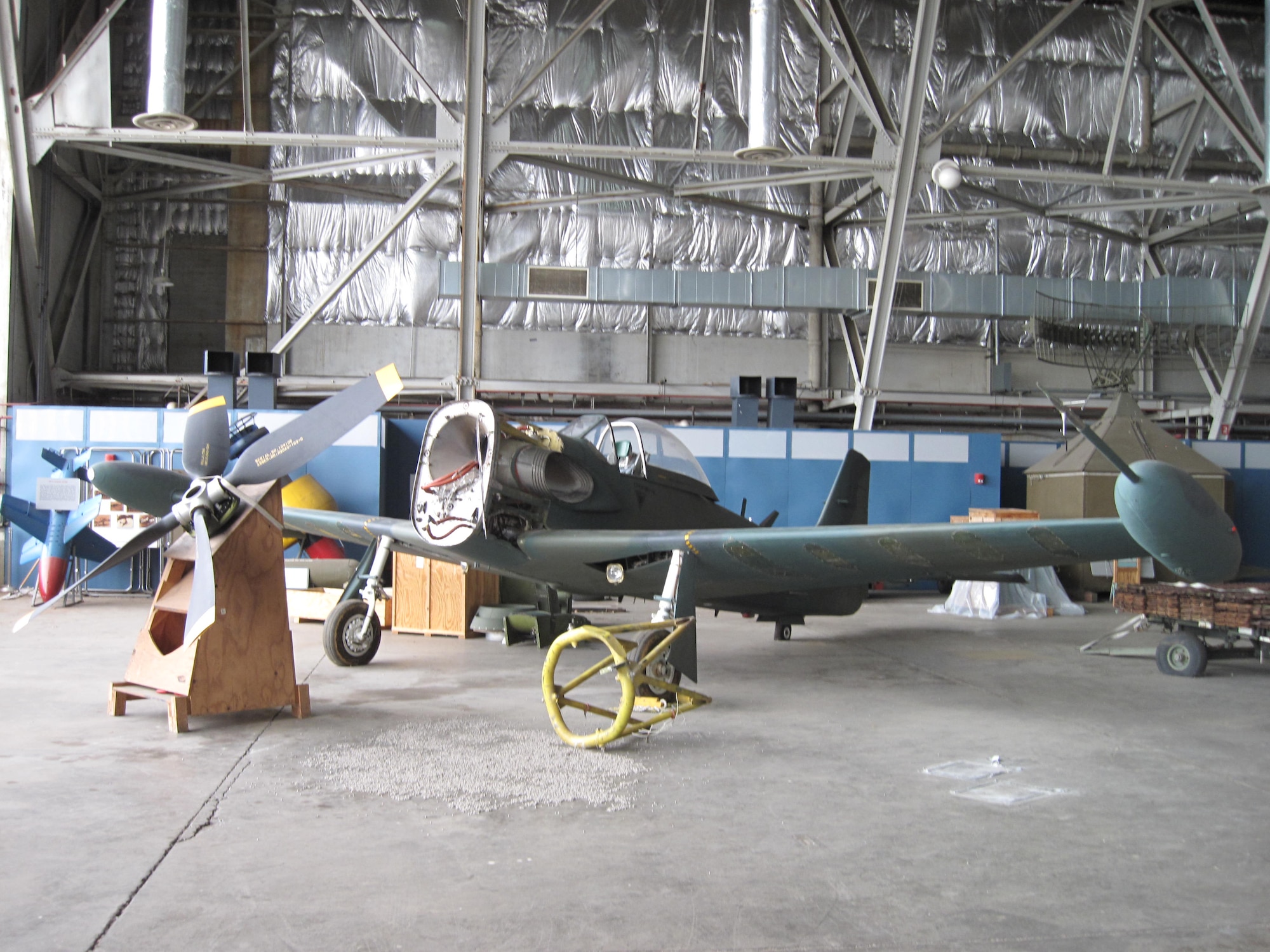 Picture of Piper PA-48E disassembled in storage hangar.