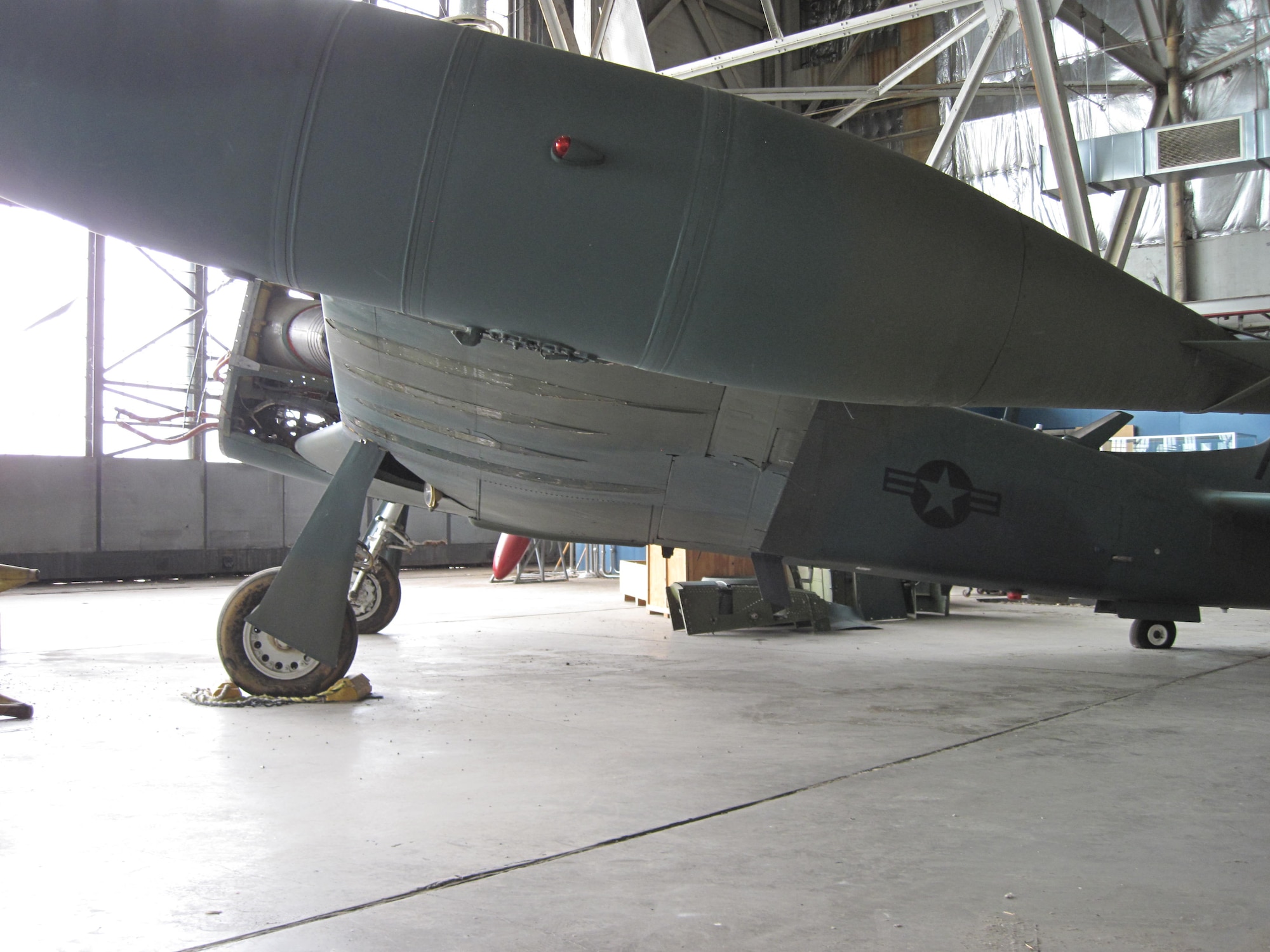 Picture of Piper PA-48E disassembled in storage hangar.