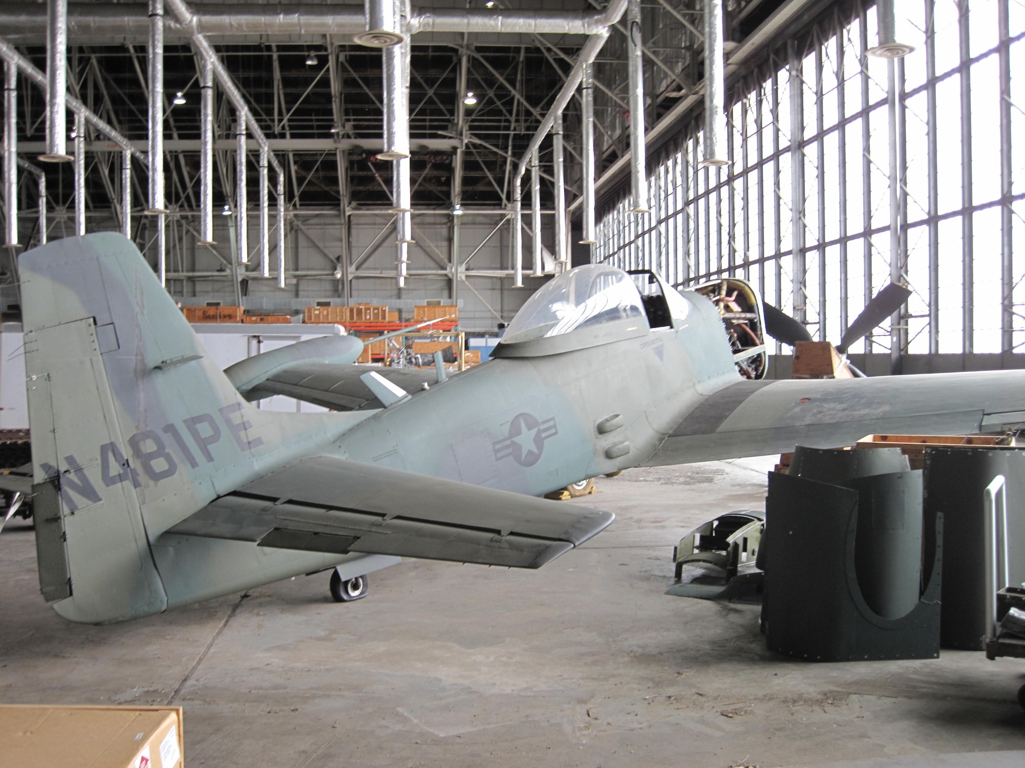 Picture of Piper PA-48E disassembled in storage hangar.