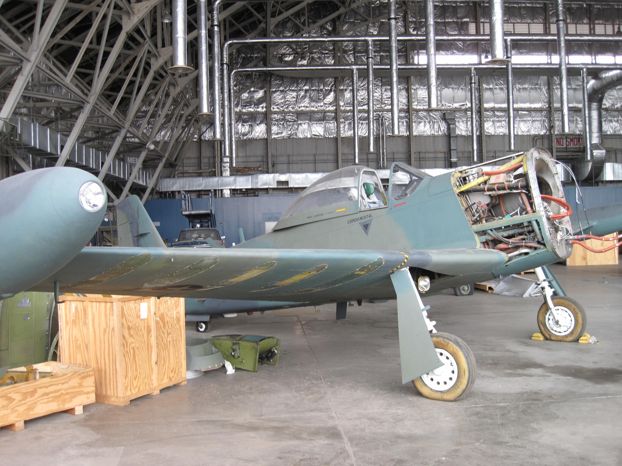 Picture of Piper PA-48E disassembled in storage hangar.