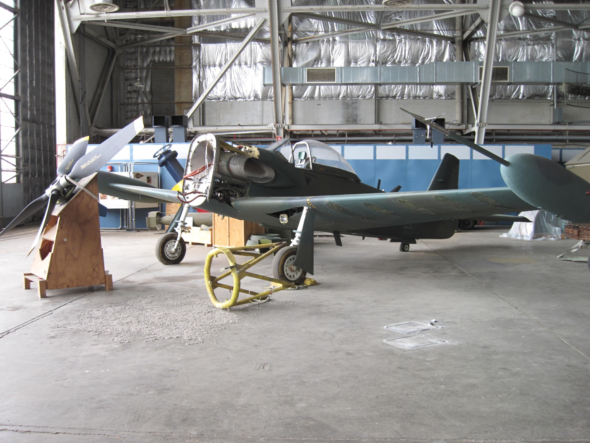 Picture of Piper PA-48E disassembled in storage hangar.