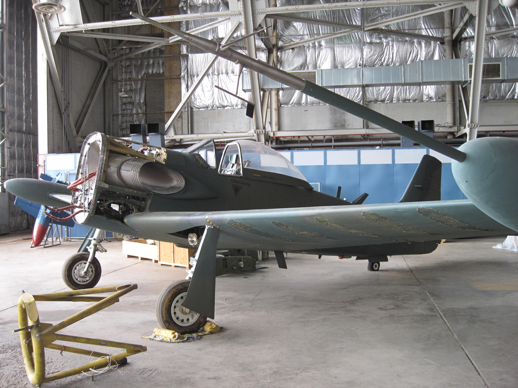 Picture of Piper PA-48E disassembled in storage hangar.