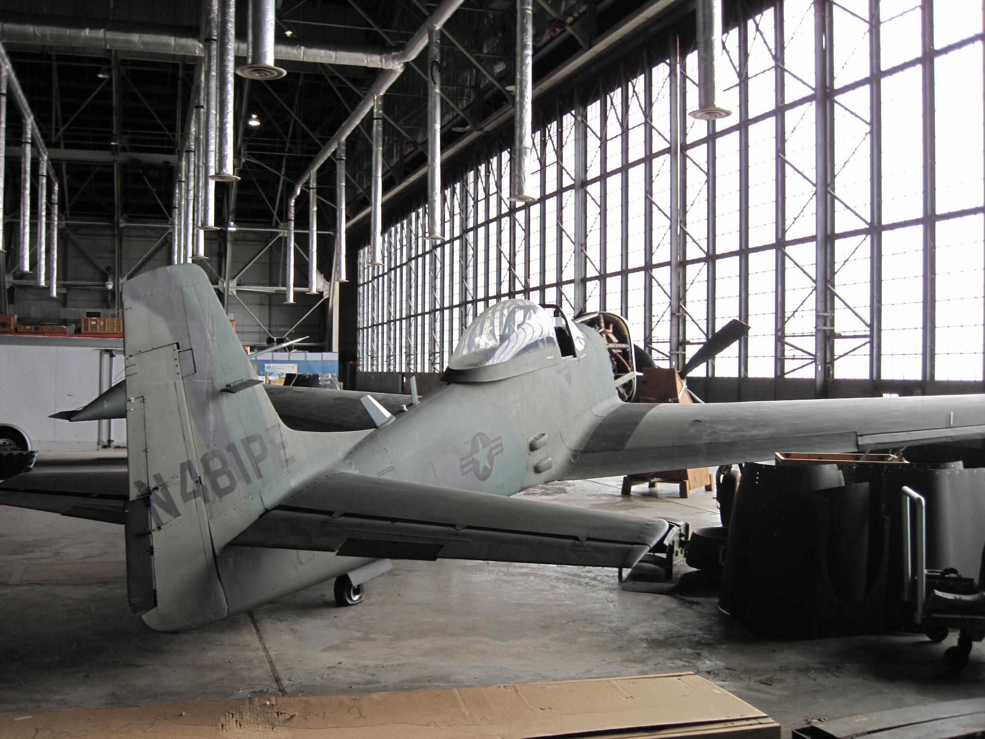 Picture of Piper PA-48E disassembled in storage hangar.