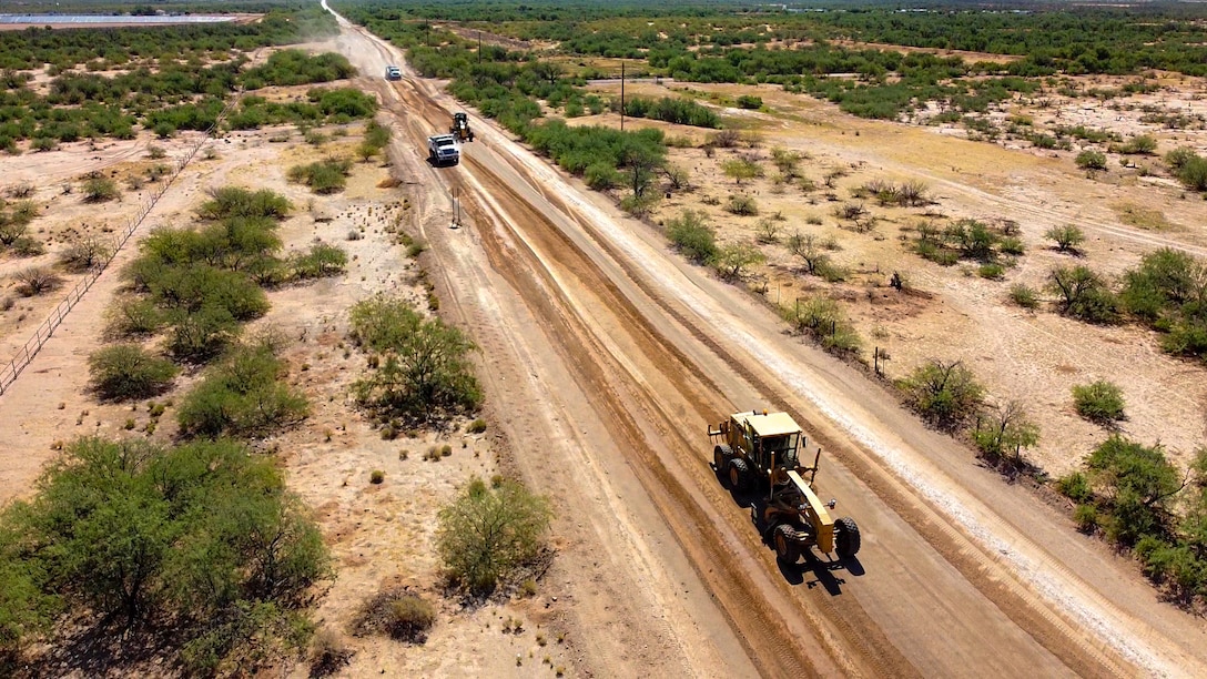 Heavy equipment operators with 6th Engineer Support Battalion, 4th Marine Logistics Group, conduct road maintenance in Pima County, Ariz. Aug. 8, 2020. The partnership with Pima County to complete this exercise allows the unit to give back to the community and keep their skills sharp while remaining safe throughout the travel restrictions. (U.S. Marine Corps photo by Lance Cpl. Christopher W. England)