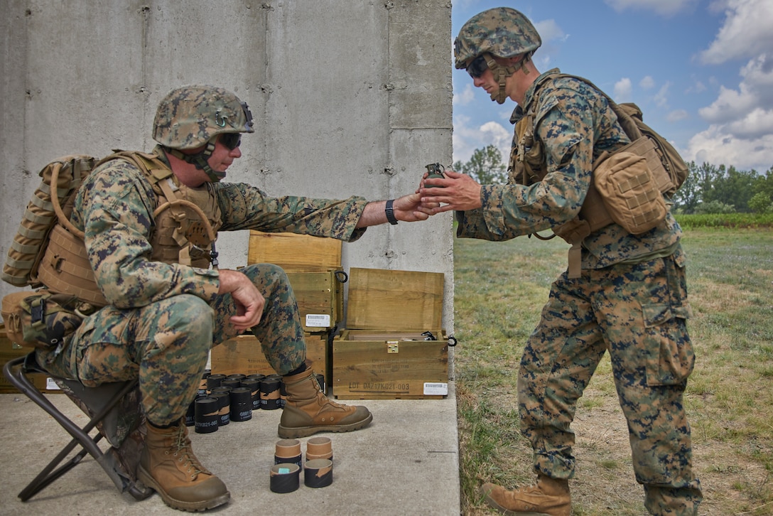 Marines with Bravo Company, 1st Battalion, 24th Marine Regiment, 4th Marine Division, prepare to launch M67 fragmentation hand grenades during an annual training exercise at Camp Grayling, Mich., Aug. 10, 2020. The training and readiness manual helps plan, execute and evaluate training to improve Marines’ proficiency. (U.S. Marine Corps photo by Lance Cpl. Leslie Alcaraz)