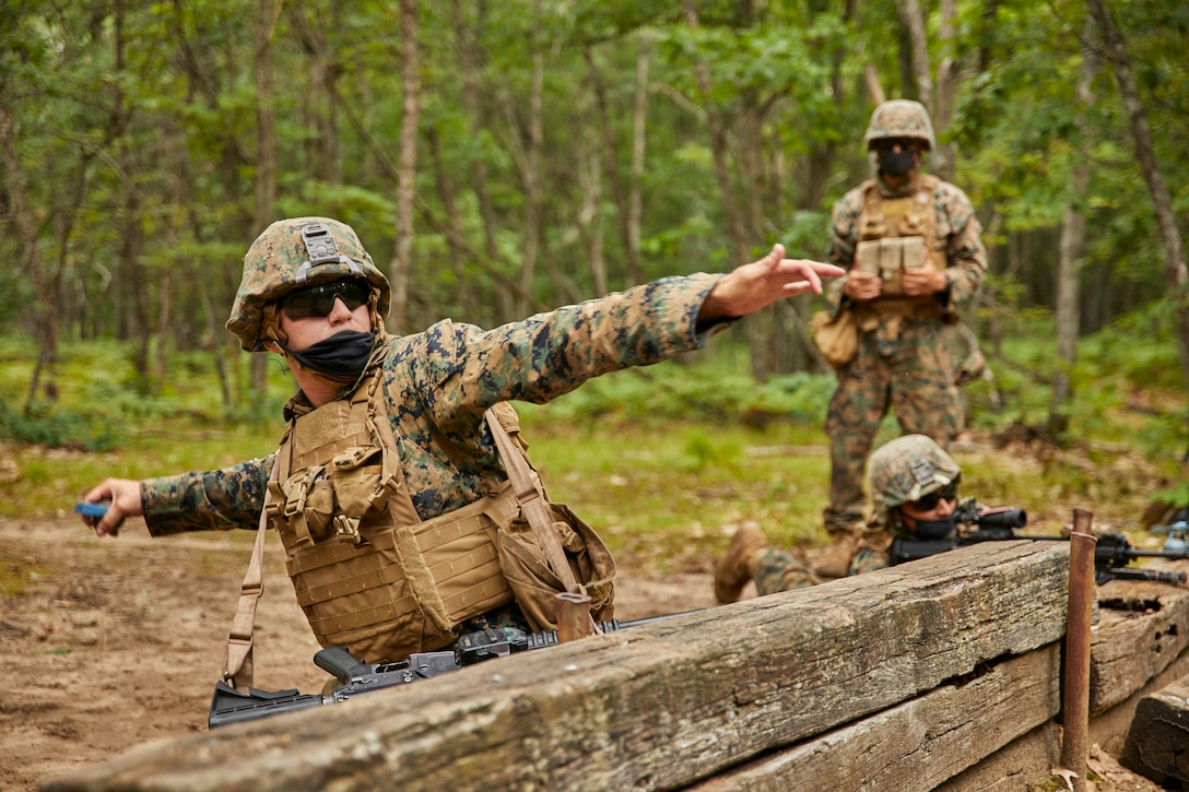 Marines with Bravo Company, 1st Battalion, 24th Marine Regiment, 4th Marine Division, practice launching blue-body colored dummy grenades at simulated enemy mortar positions at Camp Grayling, Mich., Aug. 10, 2020. This training is included in the Marine's annual training and readiness manual, which gives guidance on the equipment, ammunition, ranges and support requirements to plan and execute effective training to increase Marines’ lethality. (U.S. Marine Corps photo by Lance Cpl. Leslie Alcaraz)