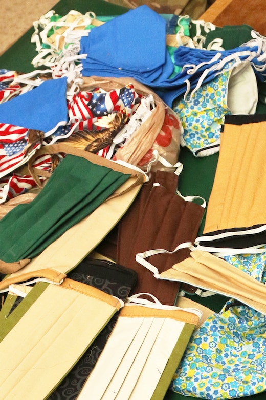 An assortment of face masks displayed on a table.