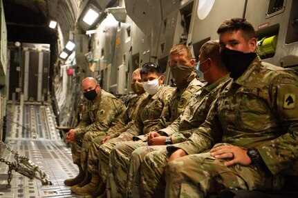 Kentucky National Guard Soldiers from 623rd Field Artillery Battalion await takeoff after loading their HIMARS onto a C-17 as apart of a HI-RAIN mission for their annual certification and training at the Louisville Air National Guard Base in Louisville, Ky., Aug. 6, 2020.