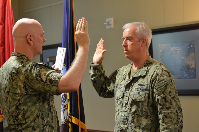 Admiral Christopher Grady, left, commander, United States Fleet Forces Command, promotes Rear Admiral John F. Meier, who assumed command of Naval Warfare Development Command (NWDC) July 3, 2019. (U.S. Navy photo by SHSN Kassandra Santa Cruz, NWDC/Released)