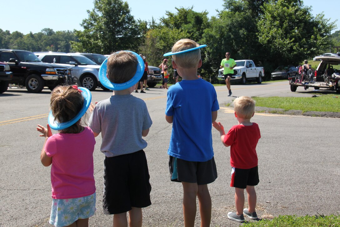 Siblings cheer on their father at Rough River Lake's Dam Triathlon