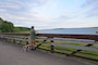 A man walking his dog on the Volksweg Trail stops to look out at Lake Red Rock near Pella, Iowa.