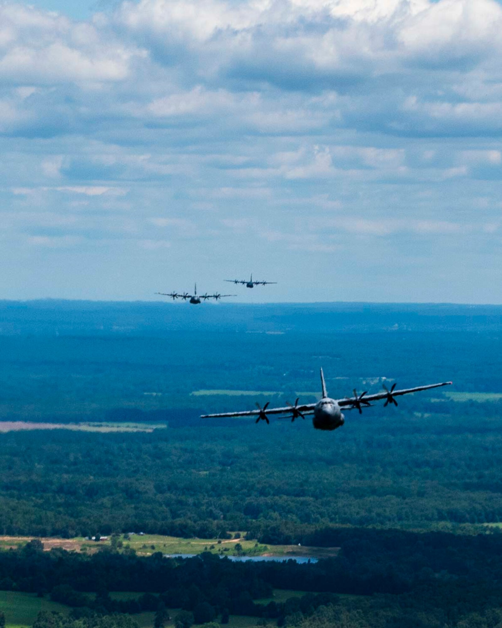 Reserve members of the 327th Airlift Squadron fly in a low level formation route along Greers Ferry Lake, Ark. on Aug. 1, 2020. This was the first in-person training event for the 913th Airlift Group since COVID-19 swept across the U.S. Using health precaution measures, reserve members were able to restore readiness while mitigating health risks, ensuring no COVID-19 cases were transmitted among members over the weekend. The majority of our Reserve members have to meet the same requirements of Active Duty personnel. This means they have to balance a full-time civilian job or college studies while maintaining their military readiness. (U.S. Air Force Reserve photo by Maj. Ashley Walker)