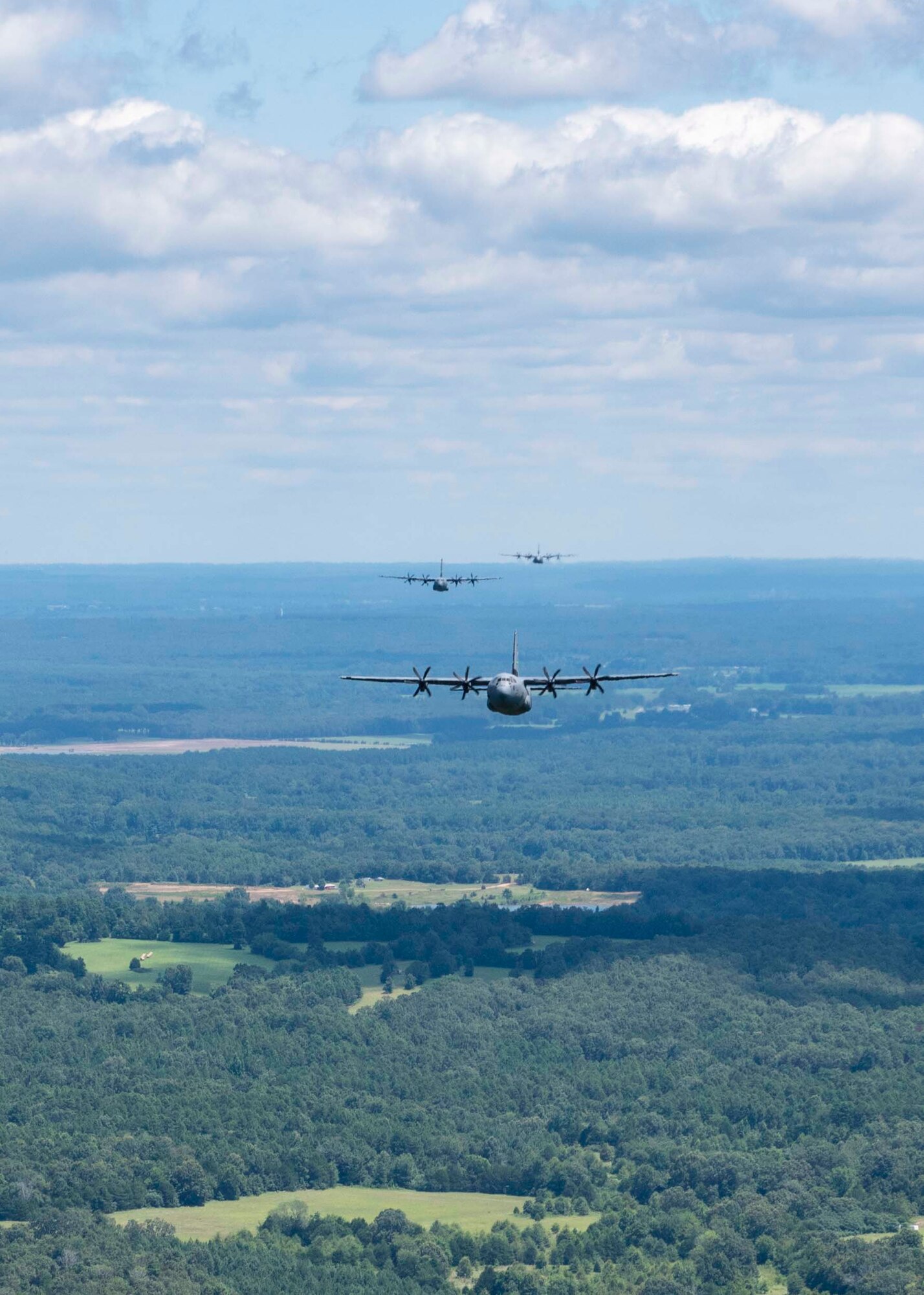 Reserve members of the 327th Airlift Squadron fly in a low level formation route along Greers Ferry Lake, Ark. on Aug. 1, 2020. This was the first in-person training event for the 913th Airlift Group since COVID-19 swept across the U.S. Using health precaution measures, reserve members were able to restore readiness while mitigating health risks, ensuring no COVID-19 cases were transmitted among members over the weekend. The majority of our Reserve members have to meet the same requirements of Active Duty personnel. This means they have to balance a full-time civilian job or college studies while maintaining their military readiness. (U.S. Air Force Reserve photo by Maj. Ashley Walker)