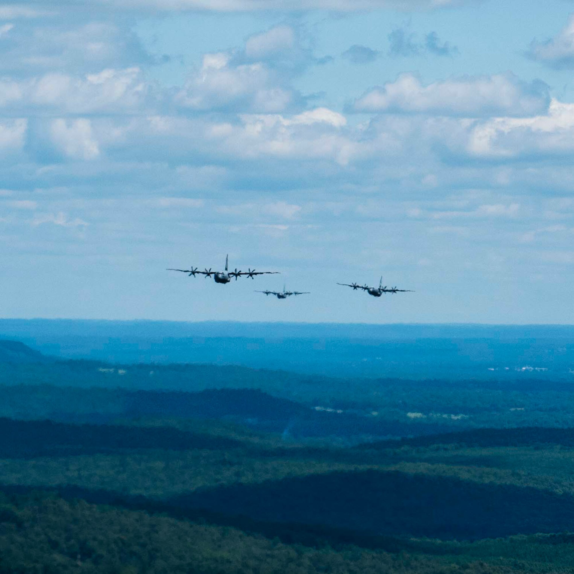 Reserve members of the 327th Airlift Squadron flying in formation in a low level route along Greers Ferry Lake, Ark. on Aug. 1, 2020. This was the first in-person training event for the 913th Airlift Group since COVID-19 swept across the U.S. Using health precaution measures, reserve members were able to restore readiness while mitigating health risks, ensuring no COVID-19 cases were transmitted among members over the weekend. The majority of our Reserve members have to meet the same requirements of Active Duty personnel. This means they have to balance a full-time civilian job or college studies while maintaining their military readiness. (U.S. Air Force Reserve photo by Maj. Ashley Walker)